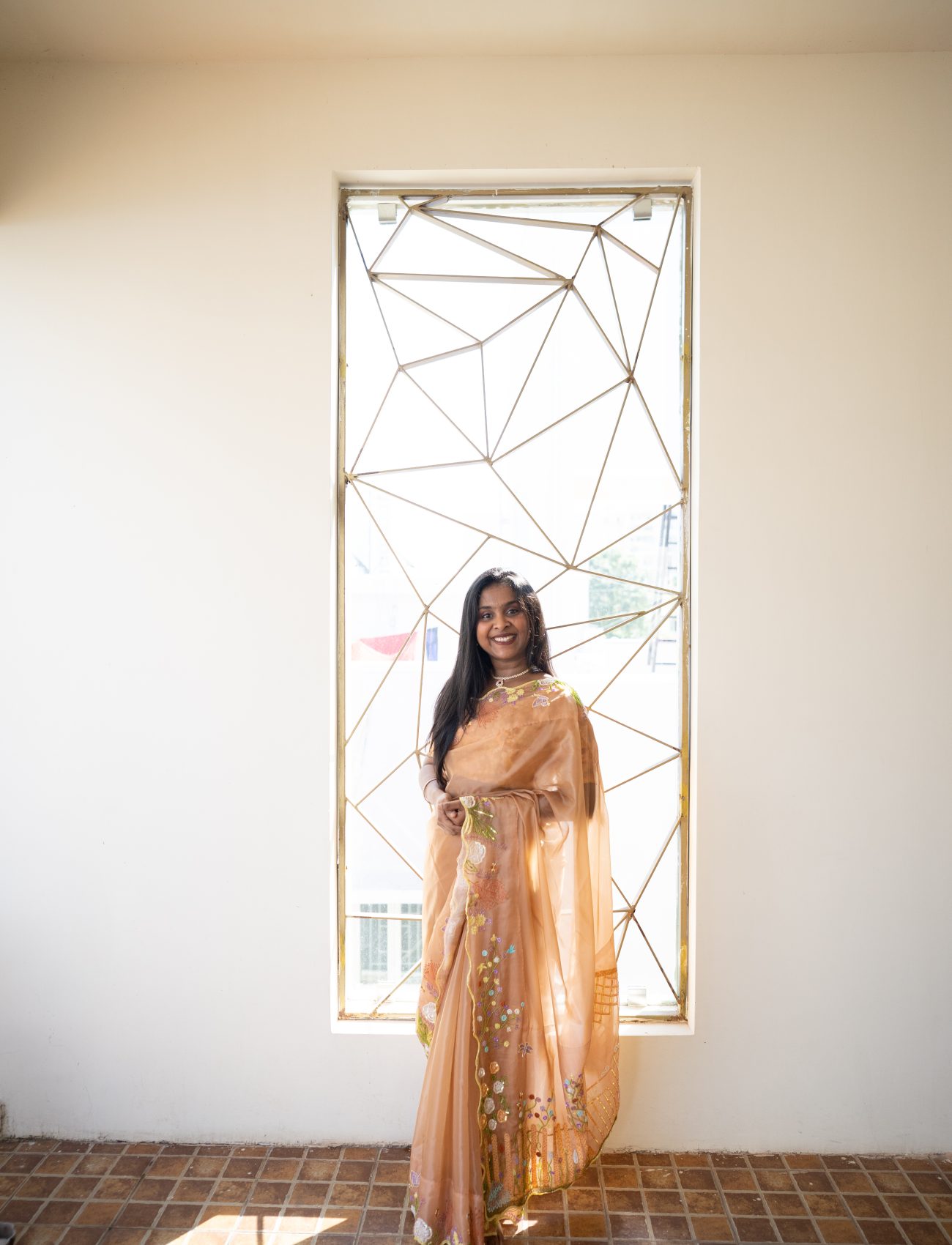 Ashaa Vigashini draped in a bespoke embroidered saree crafted by Design with Saa. Photographed by Shweta Balaji